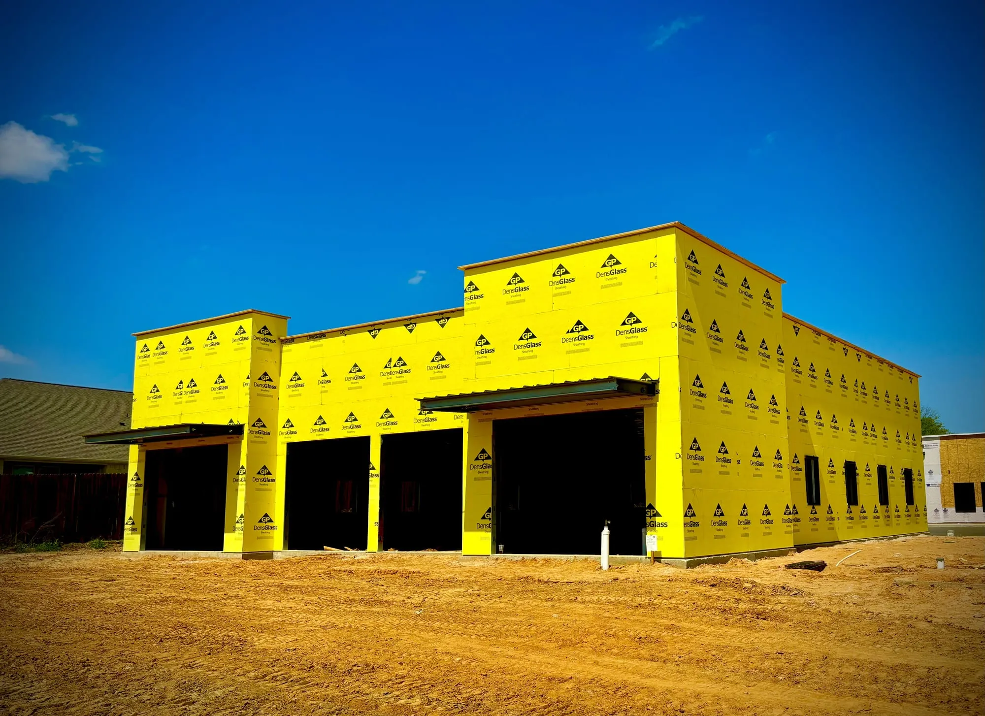 Commercial building framed, sheathed, and made ready by Premier Drywall on a Texas jobsite